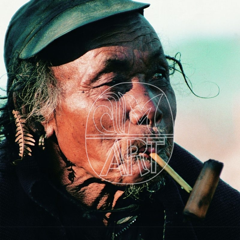 Apa Tani elder smoking a handcrafted bamboo pipe Hija Village Arunachal Pradesh