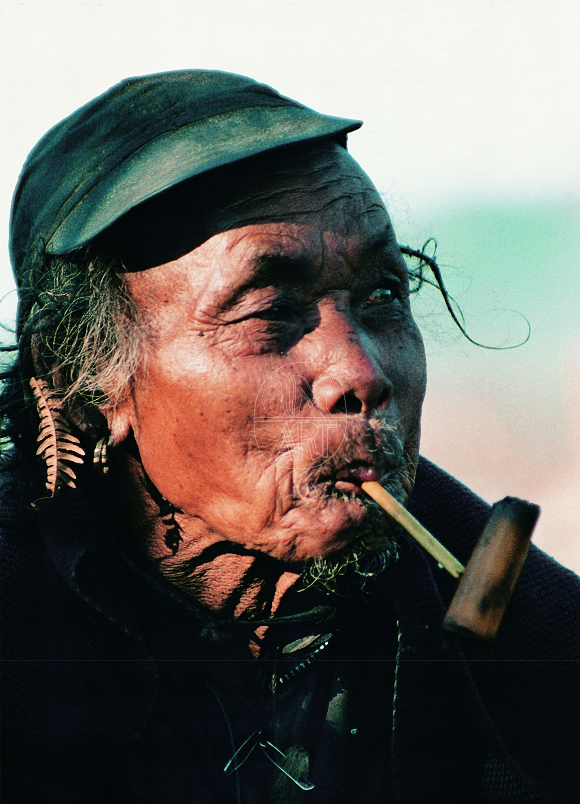 Apa Tani elder smoking a handcrafted bamboo pipe Hija Village Arunachal Pradesh