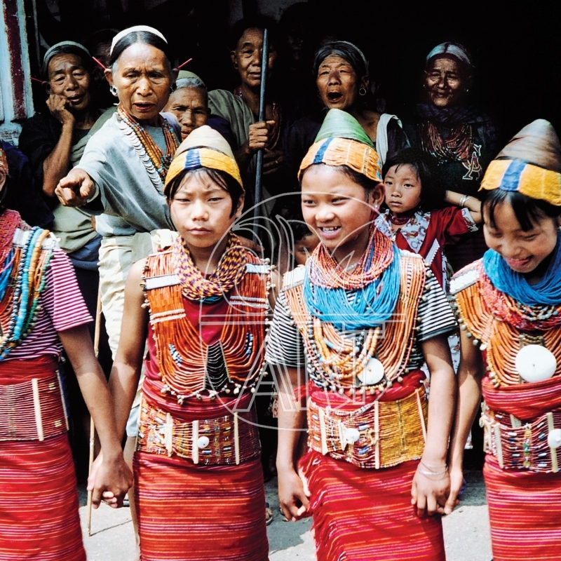 "The Queen of Chui Village instructing your Konyak girls on theror dance steps Aoling spring festival Chui Village Nagaland, 2001"